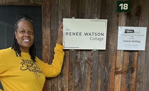 Photo of Valerie Bolling at the Renee Watson Cabin entrance