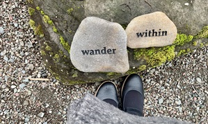Photo of word rocks that say: wander within